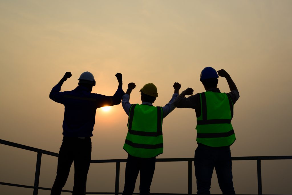 engineers checking solar panels on solar power plant