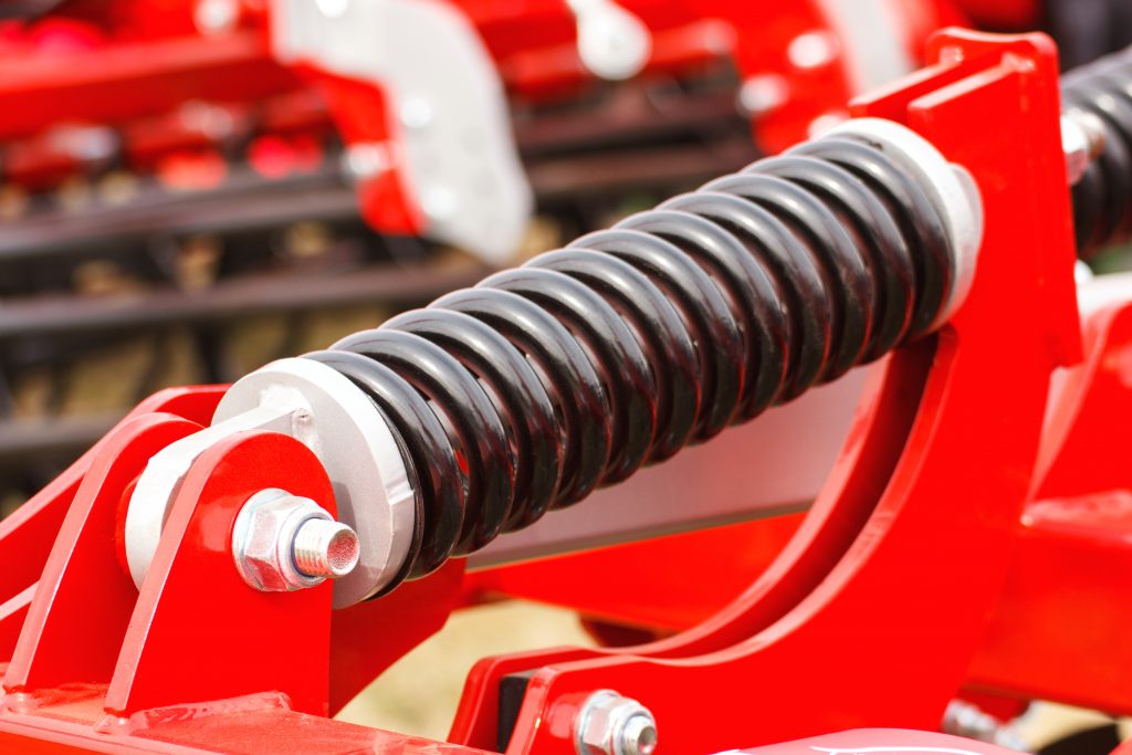 steel spring on industrial or agricultural machinery, technology and engineering