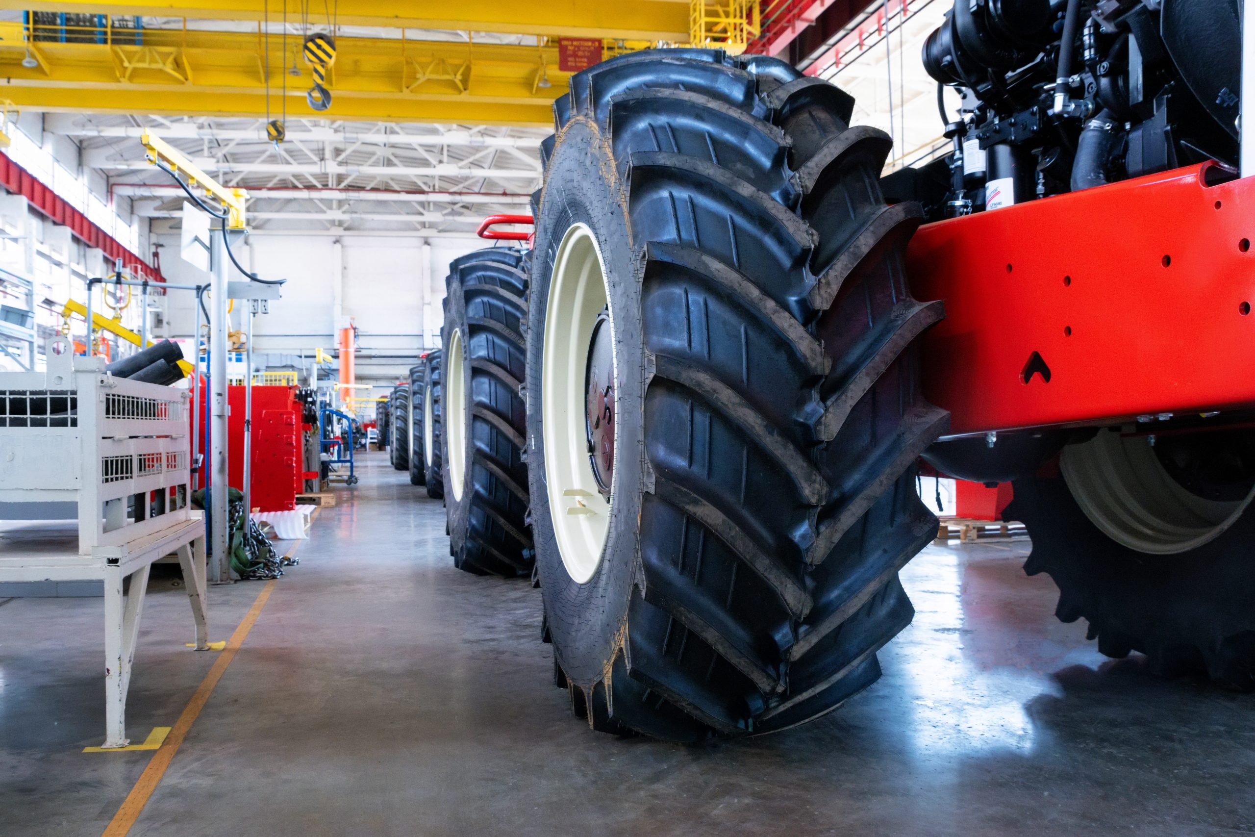 assembly workshop at big industrial plant. tractor assembling