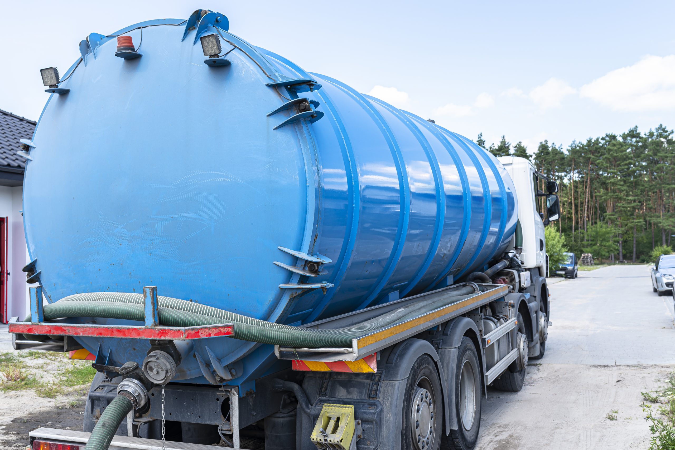 a truck with a large tank for pumping out a septic tank with a capacity of more than 20 cubic meters.